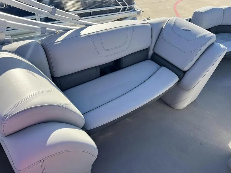 Slide: The Image of 2023 Starcraft CX 23 FD boat interior seating with gray upholstery. - 14