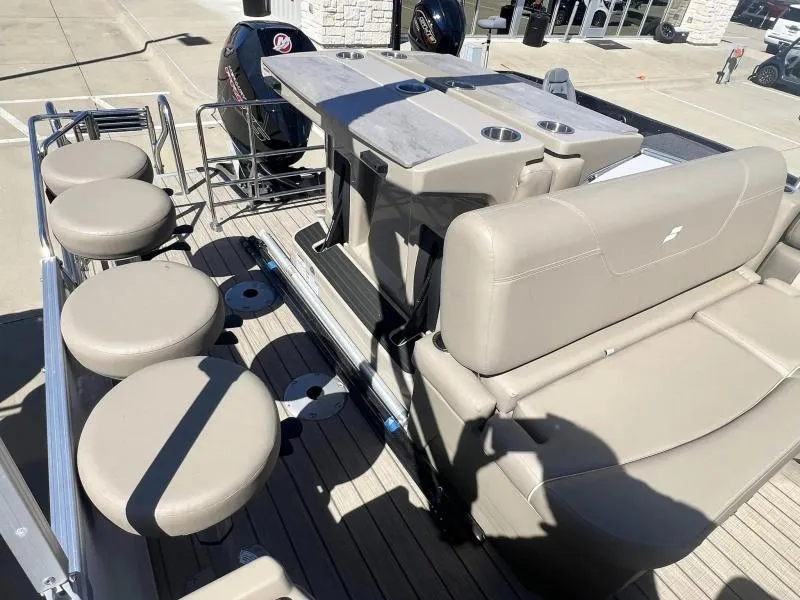 Slide: The Image of 2023 Starcraft CX 25 DL BAR pontoon boat with bar seating and Mercury outboard motor. - 10