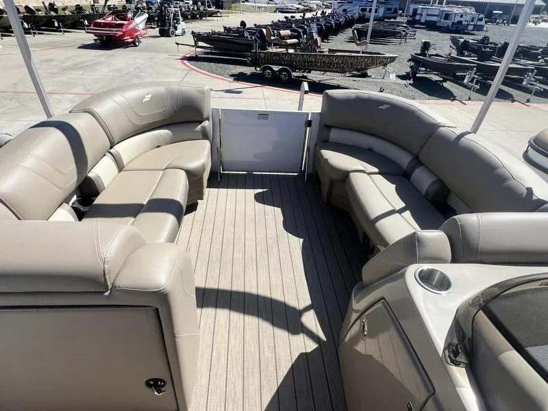 Slide: The Image of Interior of 2023 Starcraft CX 25 DL BAR pontoon boat with beige seating. - 15