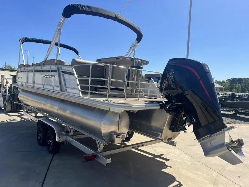 Slide: The Image of 2023 Starcraft CX 25 DL BAR pontoon boat with outboard motor on trailer. - 3