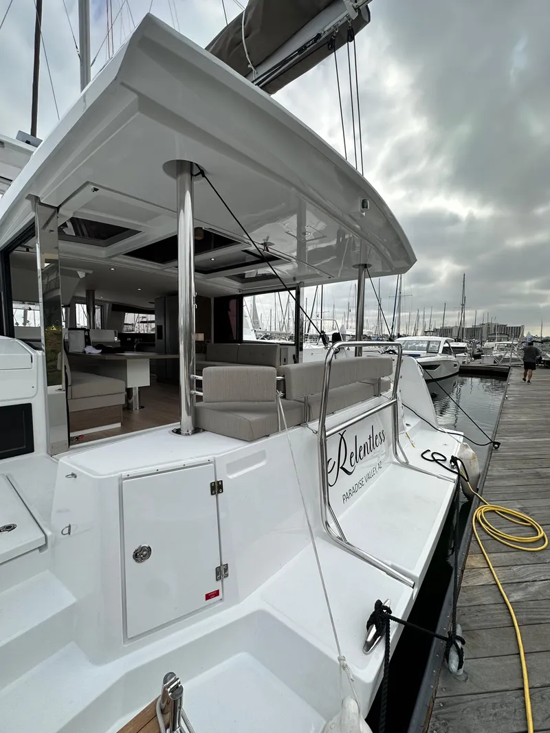 Slide: The Image of 2024 Bali 4.4 yacht docked at marina, showcasing spacious deck and modern design. - 14