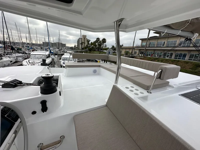 Slide: The Image of 2024 Bali 4.4 yacht interior with seating area at marina. - 20