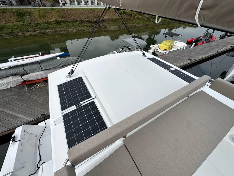 Slide: The Image of 2024 Bali 4.4 yacht with solar panels docked at a marina. - 22