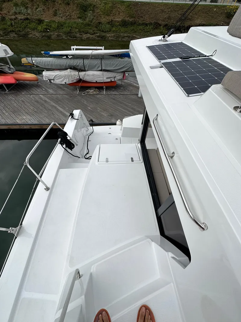 Slide: The Image of 2024 Bali 4.4 yacht deck with solar panels docked at marina. - 26