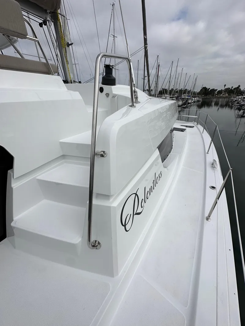 Slide: The Image of 2024 Bali 4.4 yacht named Relentless docked at a marina. - 27