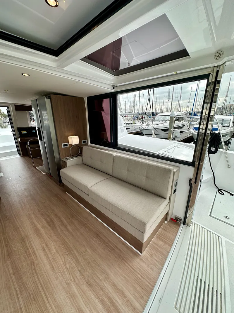 Slide: The Image of Modern interior of 2024 Bali 4.4 yacht with beige sofa and large windows. - 40
