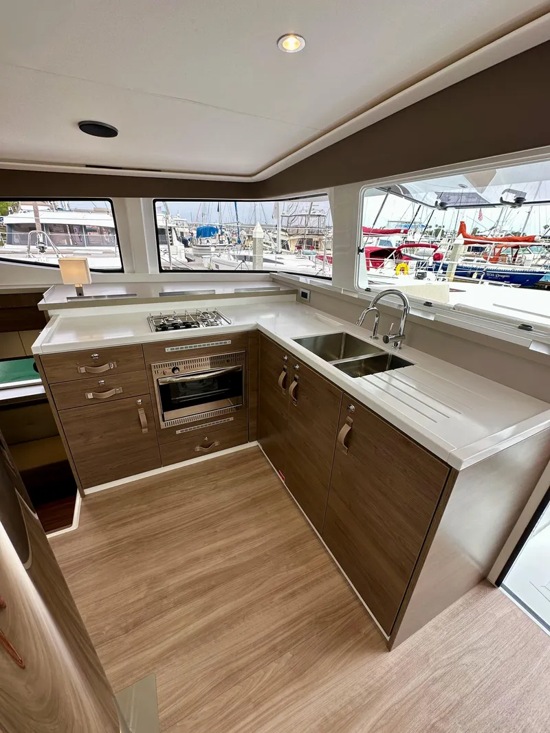 Slide: The Image of Modern kitchen in 2024 Bali 4.4 yacht with sleek design and marina view. - 45