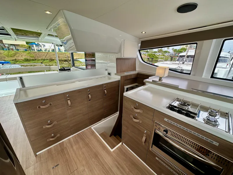 Slide: The Image of Modern kitchen interior of 2024 Bali 4.4 yacht with wood cabinets and stainless steel appliances. - 46