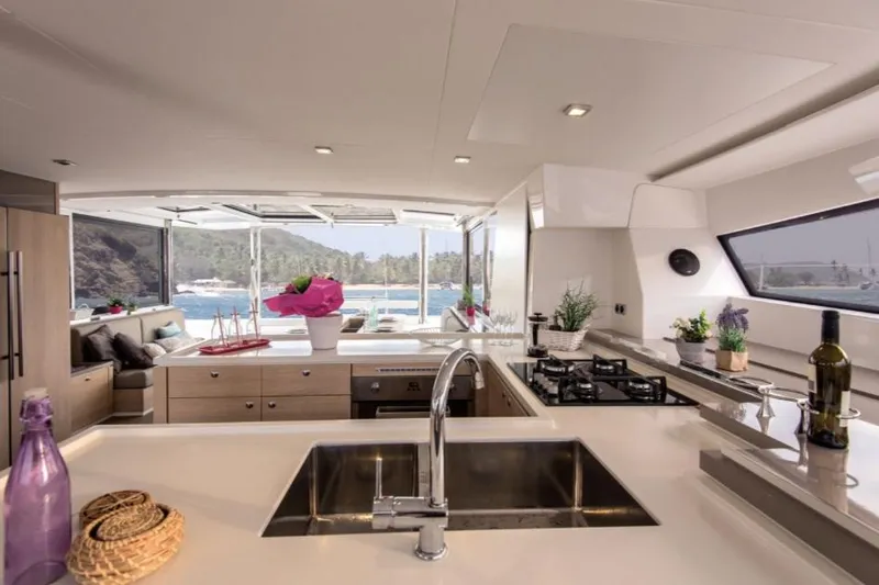 Slide: The Image of Luxurious interior of 2025 Bali 5.4 yacht with modern kitchen and scenic ocean view. - 14