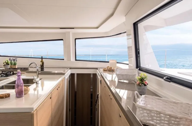 Slide: The Image of Luxurious interior of 2025 Bali 5.4 yacht with ocean view through large windows. - 15