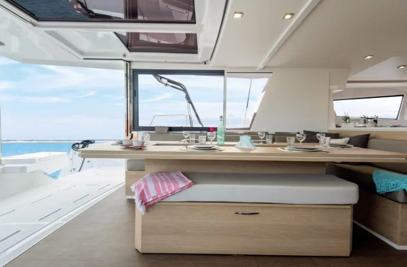 Slide: The Image of Luxurious interior of 2025 Bali 5.4 catamaran with elegant dining area and ocean view. - 18