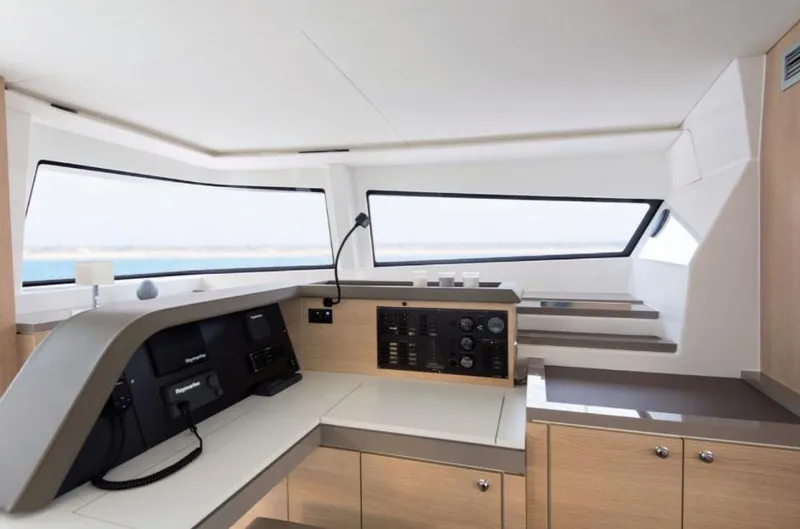 Slide: The Image of Interior of 2025 Bali 5.4 yacht, featuring modern navigation controls and sleek design. - 24