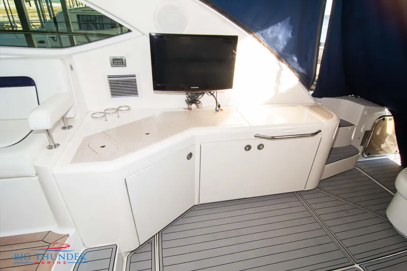 Slide: The Image of 2010 Sea Ray 540 Sundancer yacht interior with TV and seating area. - 14
