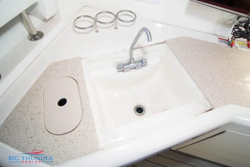 Slide: The Image of 2010 Sea Ray 540 Sundancer yacht sink with faucet and countertop. - 16