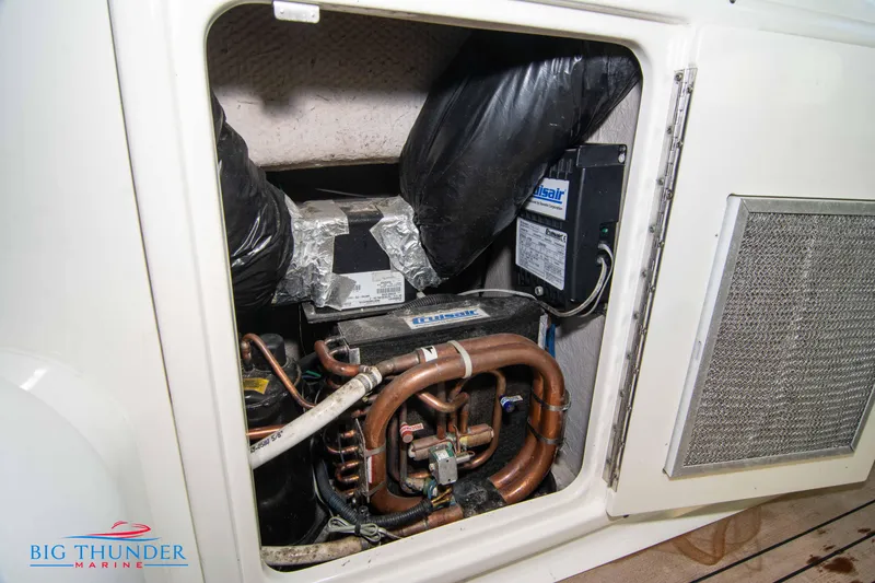 Slide: The Image of Engine compartment of 2010 Sea Ray 540 Sundancer with visible mechanical components. - 21