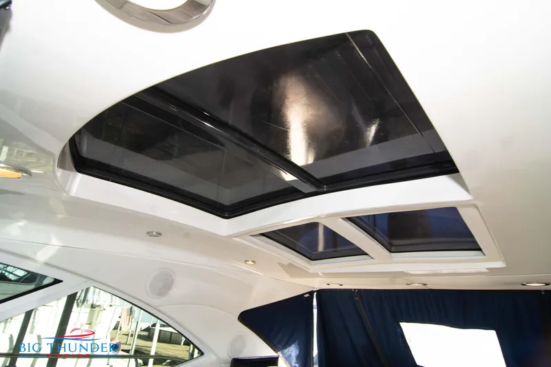 Slide: The Image of Interior view of 2010 Sea Ray 540 Sundancer yacht with skylights and curtains. - 23