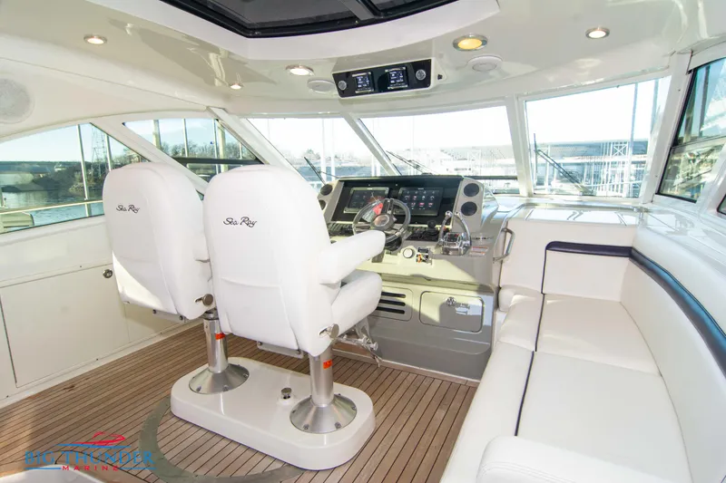 Slide: The Image of Luxurious 2010 Sea Ray 540 Sundancer yacht interior with helm and seating area. - 25