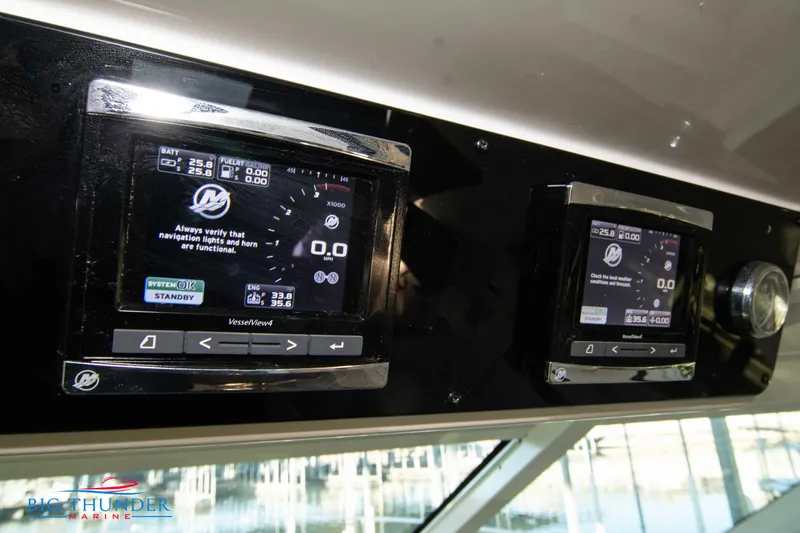 Slide: The Image of Control panel of 2010 Sea Ray 540 Sundancer yacht with digital displays. - 35