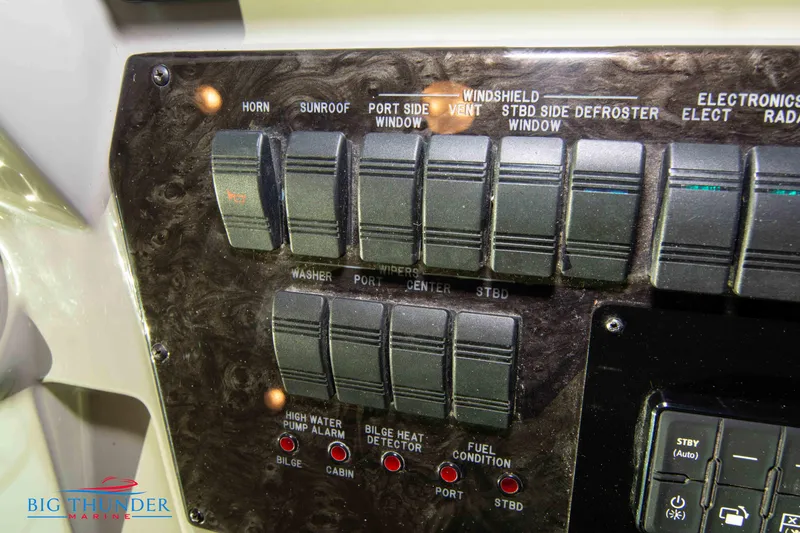Slide: The Image of Control panel of a 2010 Sea Ray 540 Sundancer boat with labeled switches and indicators. - 36
