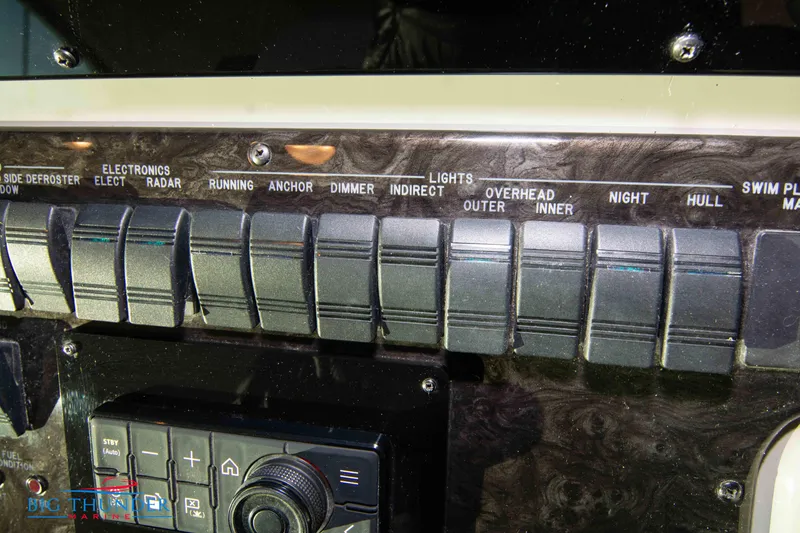 Slide: The Image of Control panel of a 2010 Sea Ray 540 Sundancer boat with labeled switches. - 37