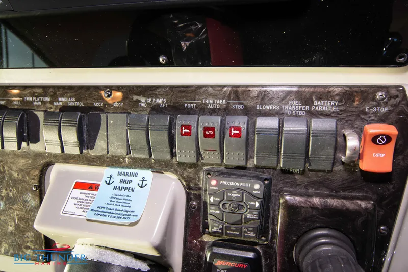Slide: The Image of Control panel of a 2010 Sea Ray 540 Sundancer boat with various switches and labels. - 38