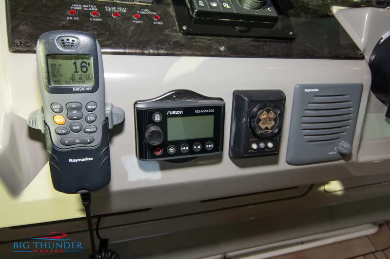 Slide: The Image of Control panel of a 2010 Sea Ray 540 Sundancer with communication and audio equipment. - 40