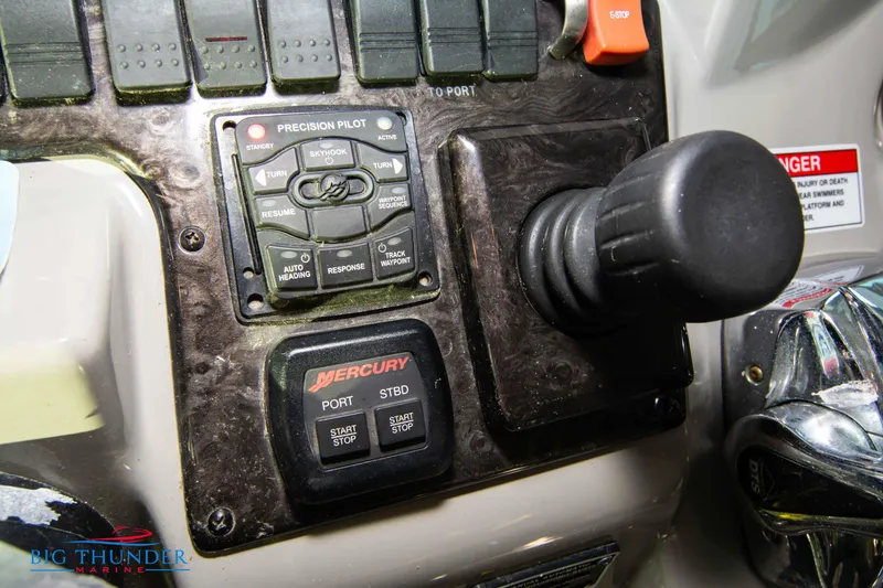 Slide: The Image of Control panel of a 2010 Sea Ray 540 Sundancer boat with Mercury controls. - 41