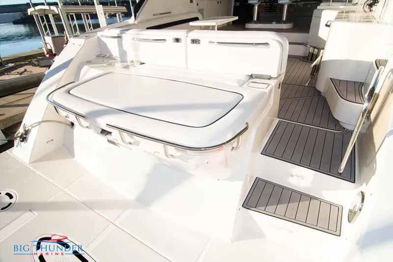 Slide: The Image of 2010 Sea Ray 540 Sundancer yacht deck with seating and storage. - 5