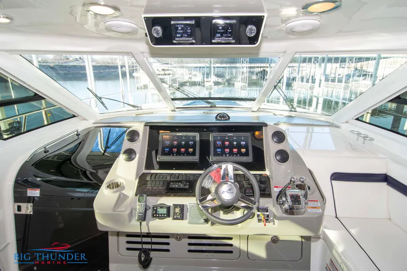 Slide: The Image of Cockpit of 2010 Sea Ray 540 Sundancer with advanced navigation systems and controls. - 27