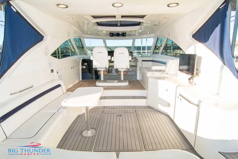 Slide: The Image of Luxurious interior of 2010 Sea Ray 540 Sundancer yacht with seating and helm. - 9