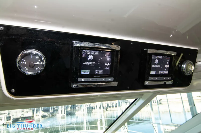 Slide: The Image of Control panel of 2010 Sea Ray 540 Sundancer yacht with digital displays and gauges. - 34