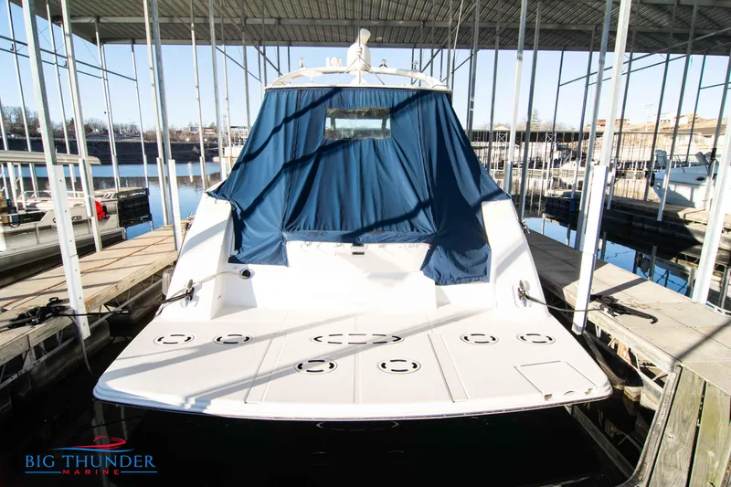 Slide: The Image of 2010 Sea Ray 540 Sundancer docked at marina with blue cover. - 3