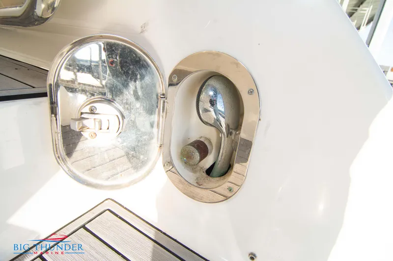 Slide: The Image of Fuel cap of 2010 Sea Ray 540 Sundancer yacht, open with metal cover. - 8
