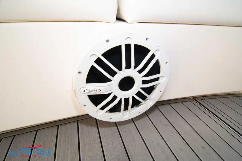 Slide: The Image of Speaker on 2010 Sea Ray 540 Sundancer yacht, featuring white upholstery and teak flooring. - 13