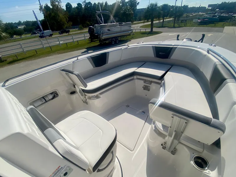 Slide: The Image of 2026 Robalo R250 boat interior with white seating and modern design. - 24