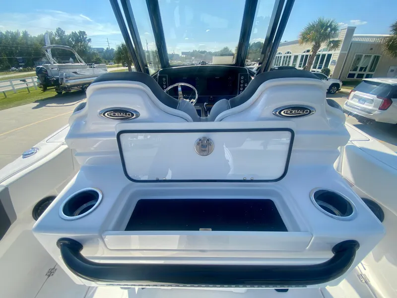 Slide: The Image of 2026 Robalo R250 boat cockpit with dual seats and cup holders. - 16