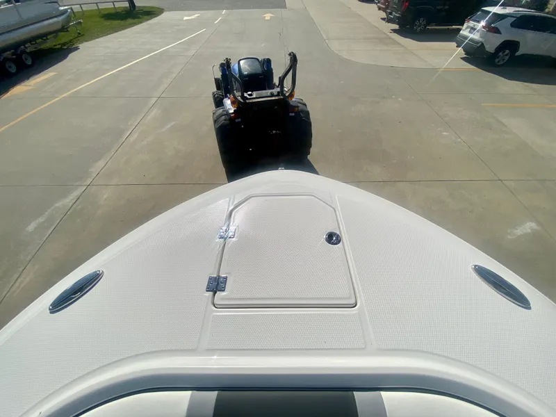 Slide: The Image of Bow view of 2026 Robalo R250 boat on trailer in parking lot. - 30