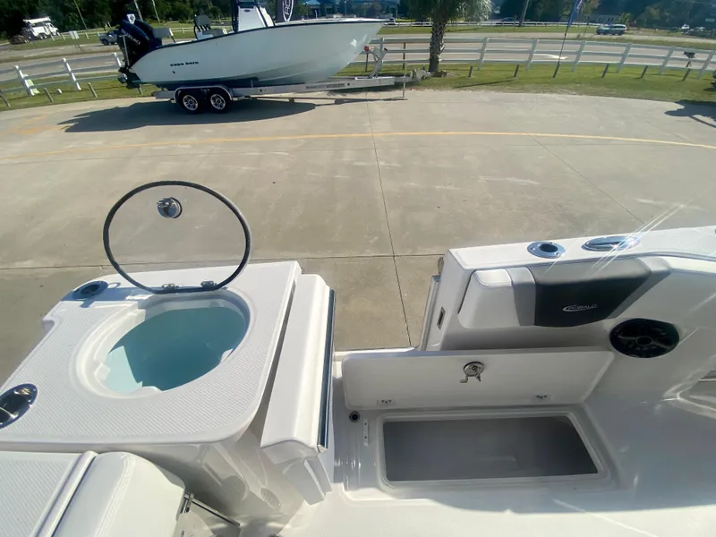 Slide: The Image of 2026 Robalo R250 boat interior with livewell and storage compartments. - 13