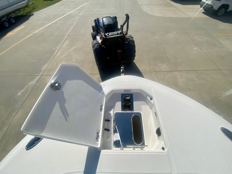 Slide: The Image of 2026 Robalo R250 boat with open hatch, viewed from above, on a trailer. - 31