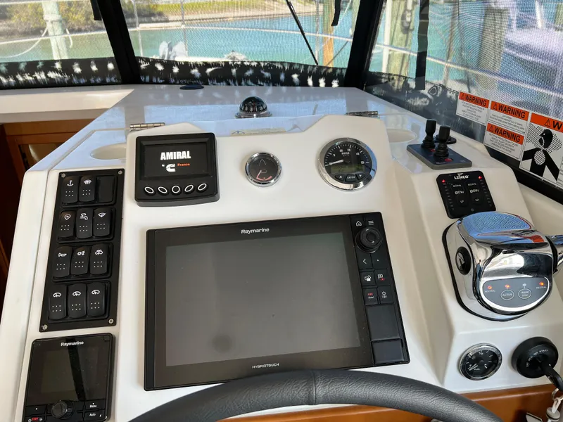 Slide: The Image of Helm station of 2021 Beneteau Swift Trawler 35 with navigation equipment. - 10