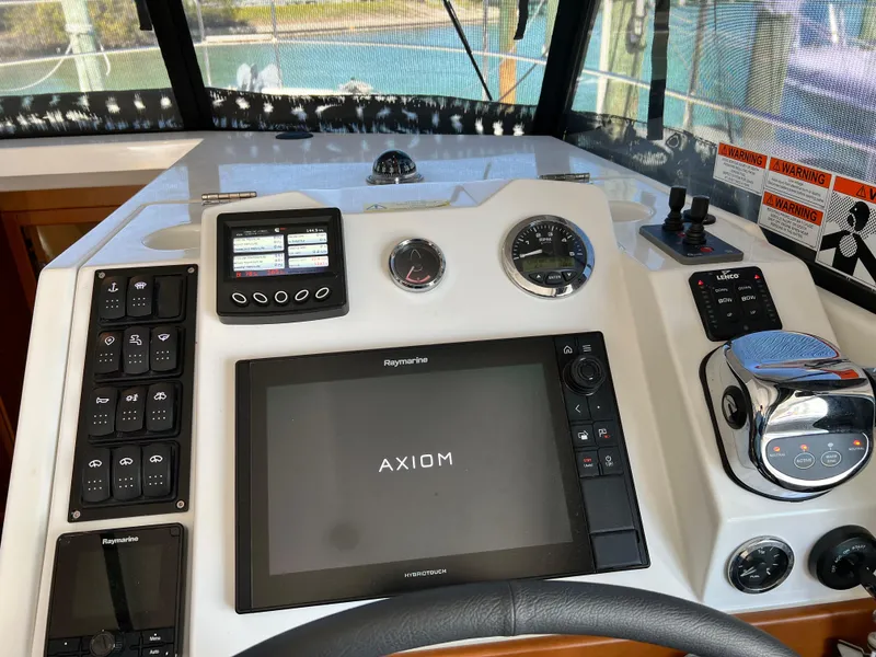 Slide: The Image of Helm station of 2021 Beneteau Swift Trawler 35 with Raymarine Axiom display. - 11