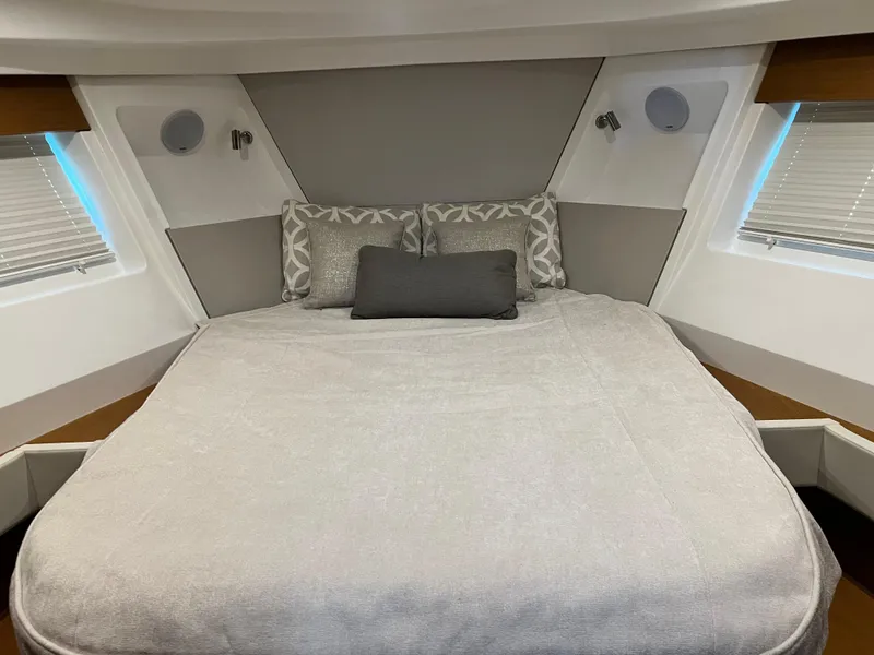 Slide: The Image of Beneteau Swift Trawler 35 2021 master bedroom with modern decor and comfortable bedding. - 25