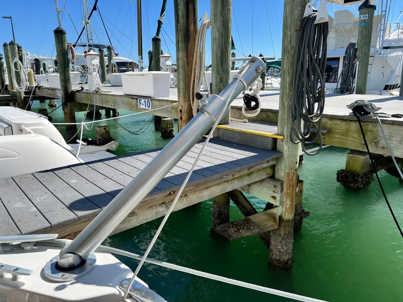 Slide: The Image of Beneteau Swift Trawler 35 (2021) docked at marina with clear water and wooden piers. - 43