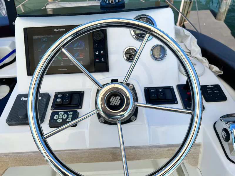 Slide: The Image of Steering wheel and control panel of a 2021 Beneteau Swift Trawler 35. - 44