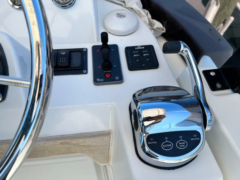 Slide: The Image of 2021 Beneteau Swift Trawler 35 helm controls and throttle. - 47