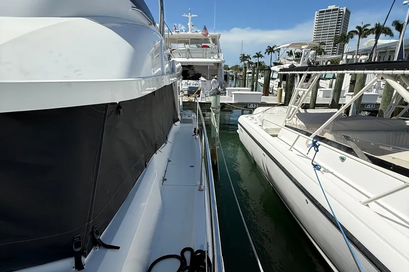 Slide: The Image of 2021 Beneteau Swift Trawler 35 docked at marina with other boats. - 6