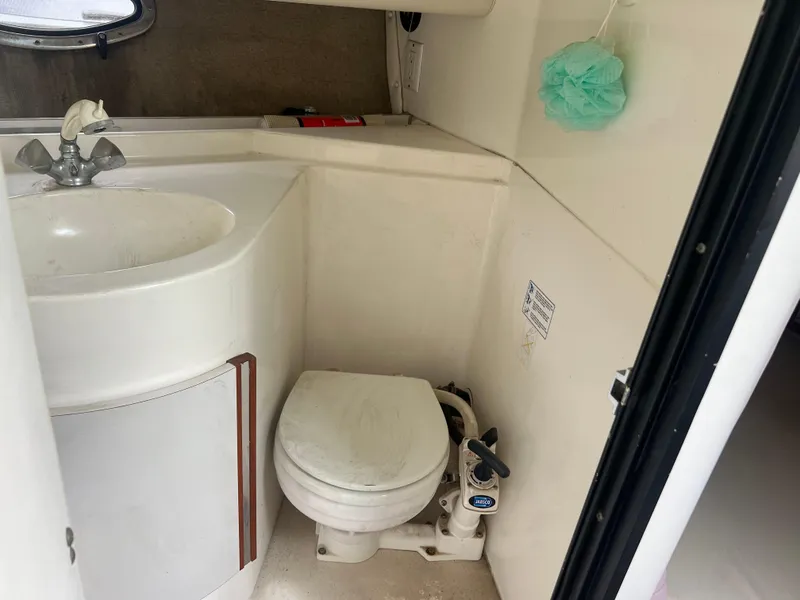 Slide: The Image of 1991 Cruisers Yachts Rouge 33 bathroom with sink and toilet. - 32
