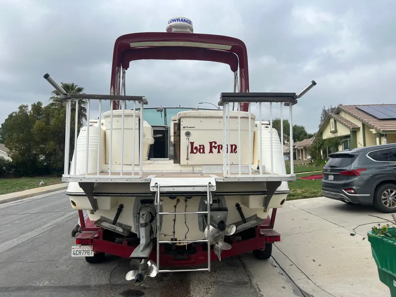Slide: The Image of 1991 Cruisers Yachts Rouge 33 boat parked on a residential street. - 5