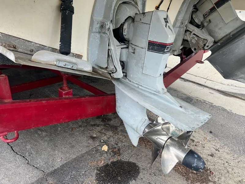 Slide: The Image of 1991 Cruisers Yachts Rouge 33 boat propeller and stern drive on red trailer. - 7