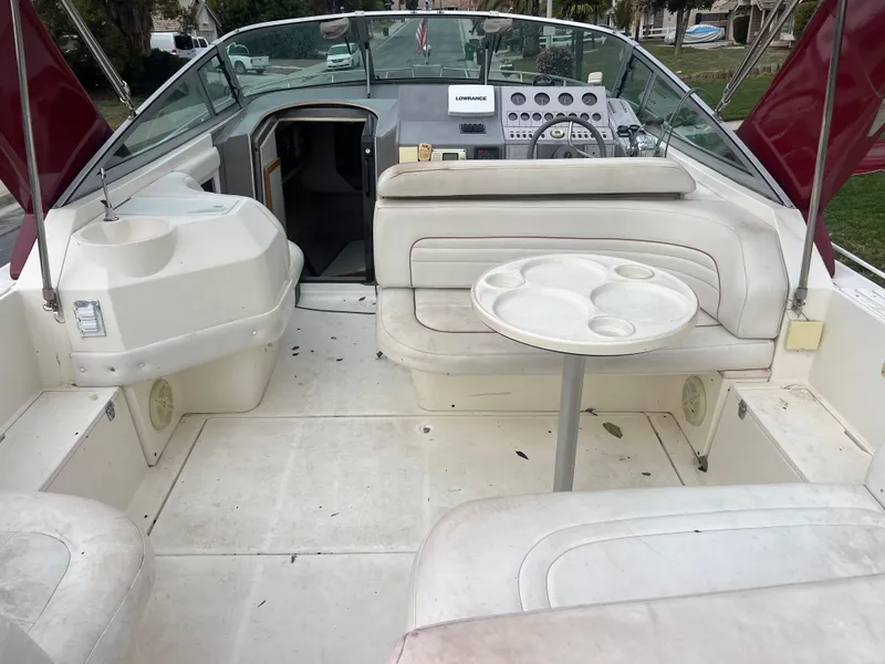 Slide: The Image of 1991 Cruisers Yachts Rouge 33 interior with seating and control panel. - 8